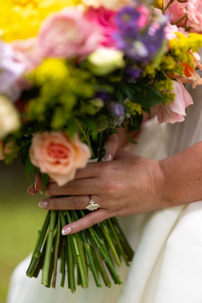 bridal bouquet and ring shot. True to color wedding photographer Eau Claire wedding photographer