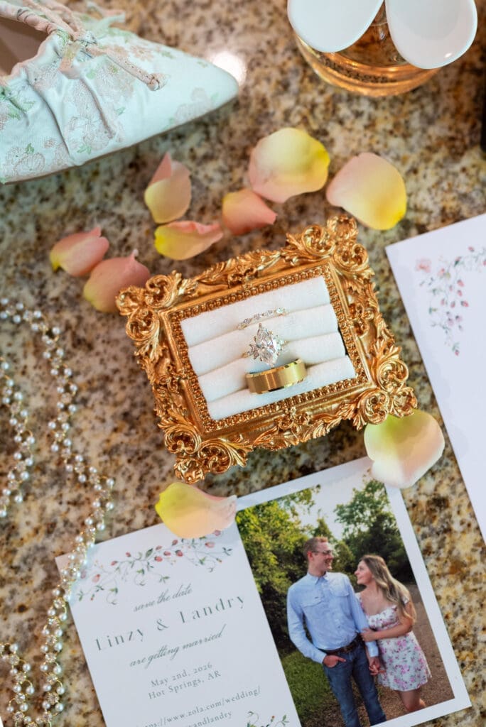 Wedding details shot showing ring and invites. True to color Hot Springs wedding photographer