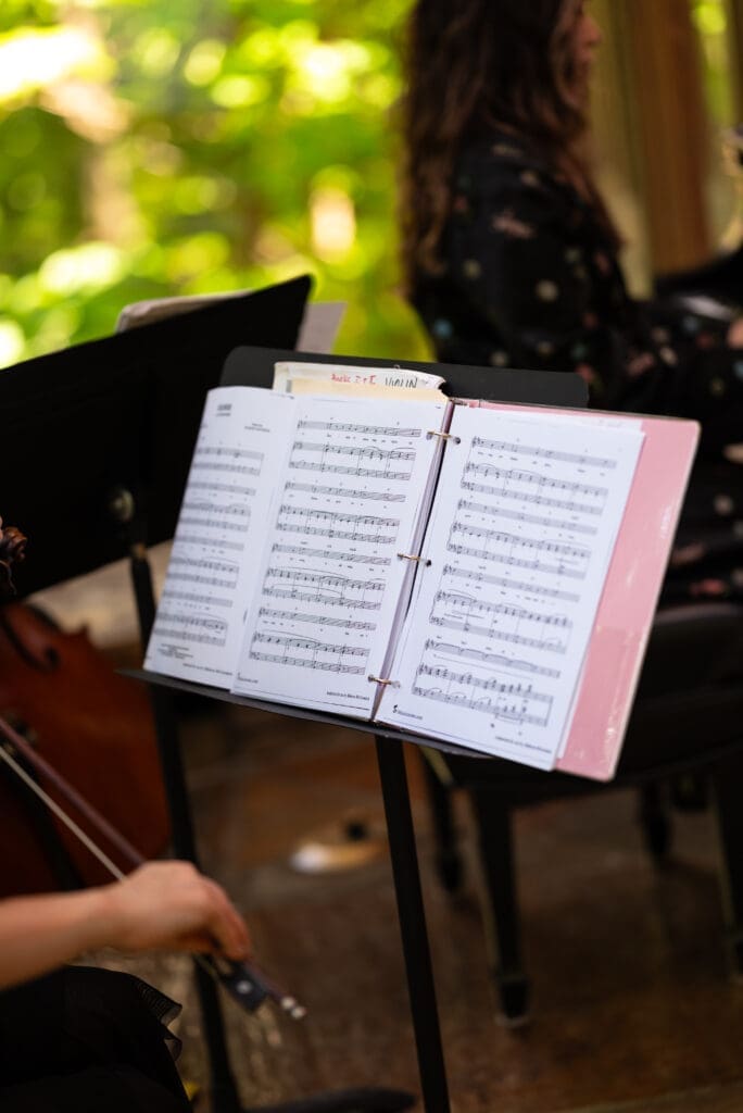 Detail shot of music sheets from live ceremony music. Editorial wisconsin wedding photographer