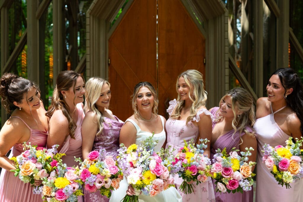 Bridal party in front of Anthony Chapel in Hot Springs, Arkansas. Shot by editorial wedding photographer Maddie, of Spirited Sage Photography