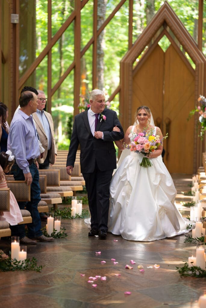 Bride and father walking down aisle at Anthony Chapel in Hot Springs, AR. Wisconsin wedding photographer