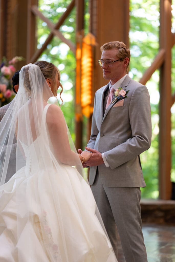 Bride and groom at Anthony Chapel, a Hot Springs garden wedding venue. Hot Springs, AR destination wedding photographer