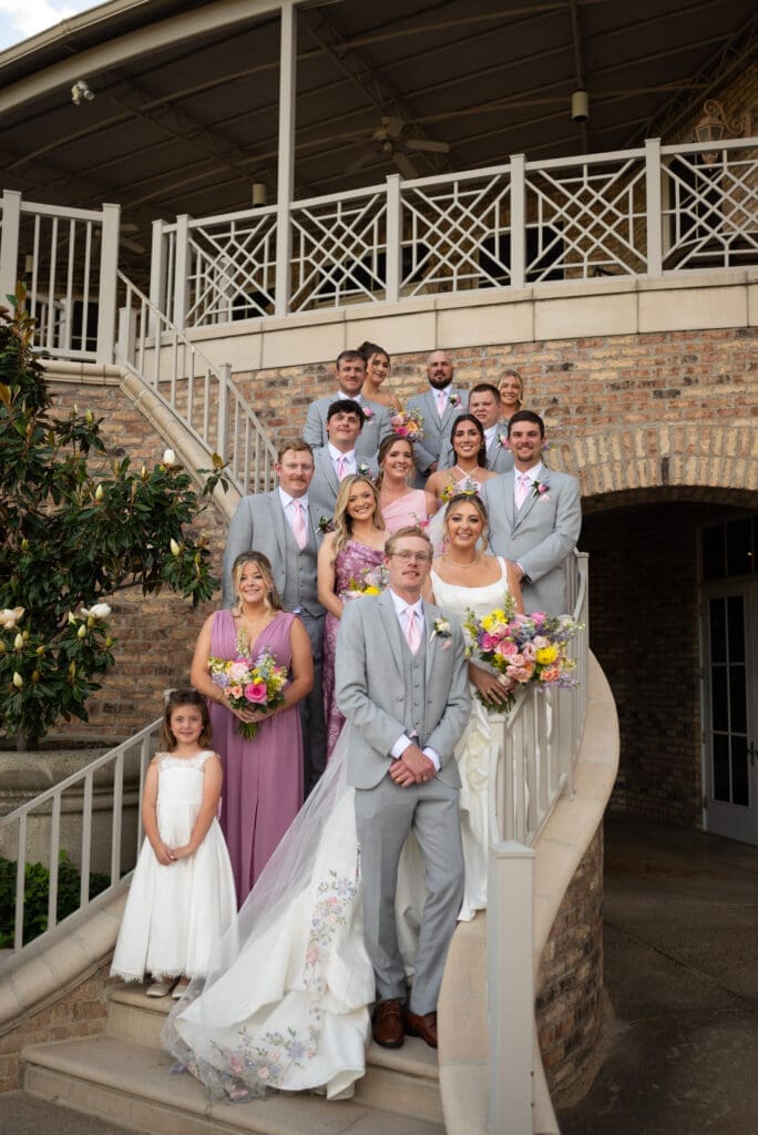 Wedding party on steps of Hot Springs Country Club in Hot Springs, Arkansas. A timeless wedding shot by Spirited Sage Photography