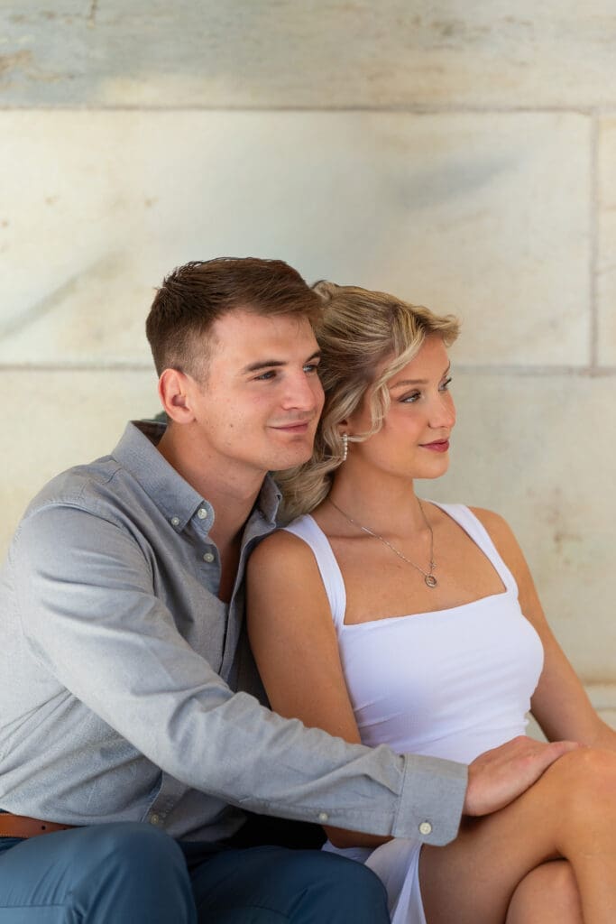 MN State Capitol engagement photos are timeless and classy option for luxury engagement photo session. Shows man and woman on steps in embrace, photo by Spirited Sage Photography, a true color traditional wedding photographer based out of Eau Claire, WI