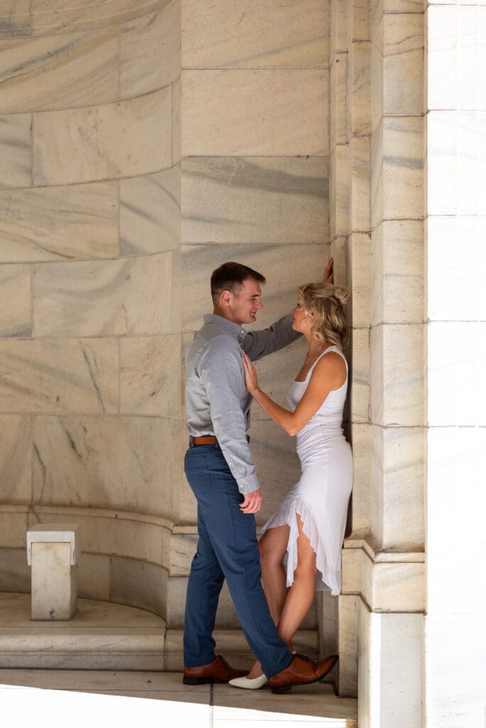 MN State Capitol Engagement Session in true to color style, shows couple against marble, by Maddie, a true color Eau Claire wedding photographer