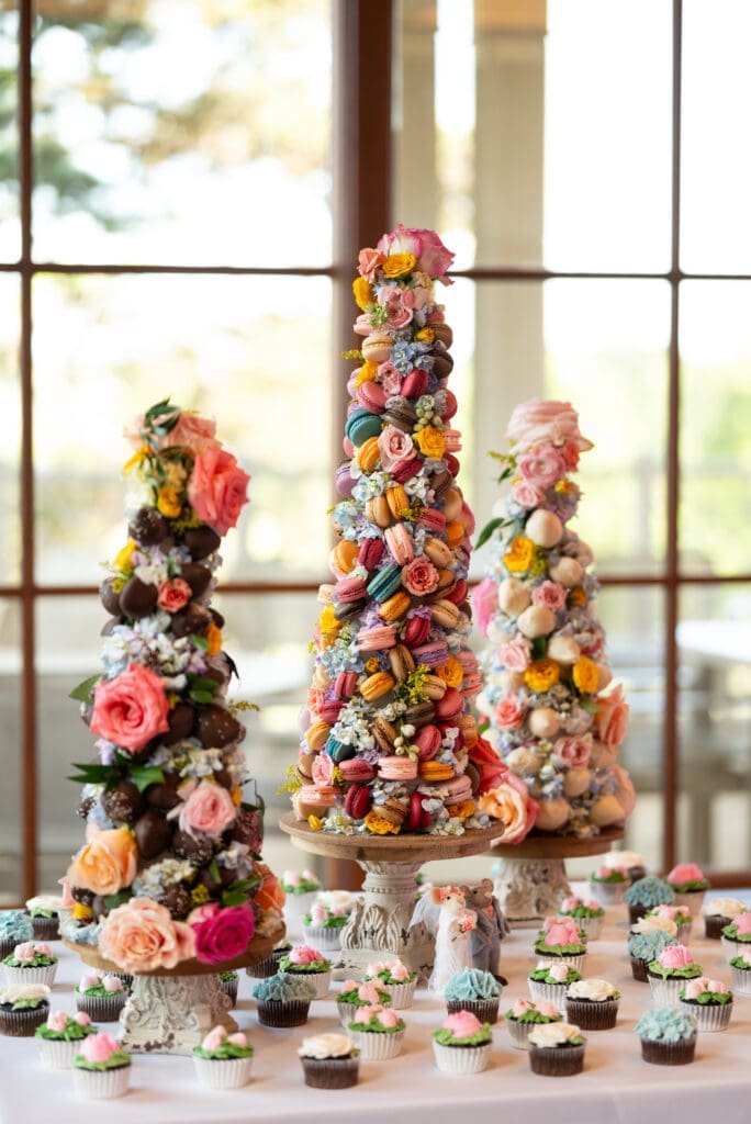 Gorgeous dessert tower featuring macrons, fruit, and florals. Timeless true color wedding photographer