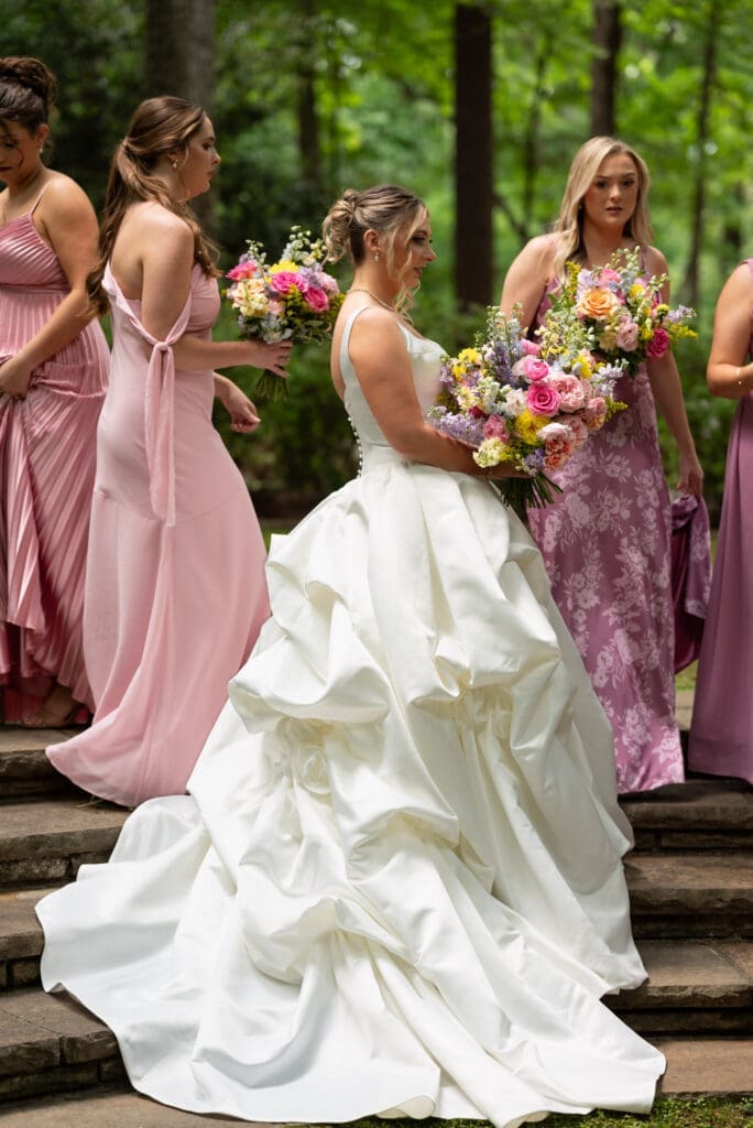 Gorgeous full gown portrait showing bride's ruffled silky ball gown style wedding dress. Photographed by Maddie from Spirited Sage Photography, a Wisconsin based travel wedding photographer