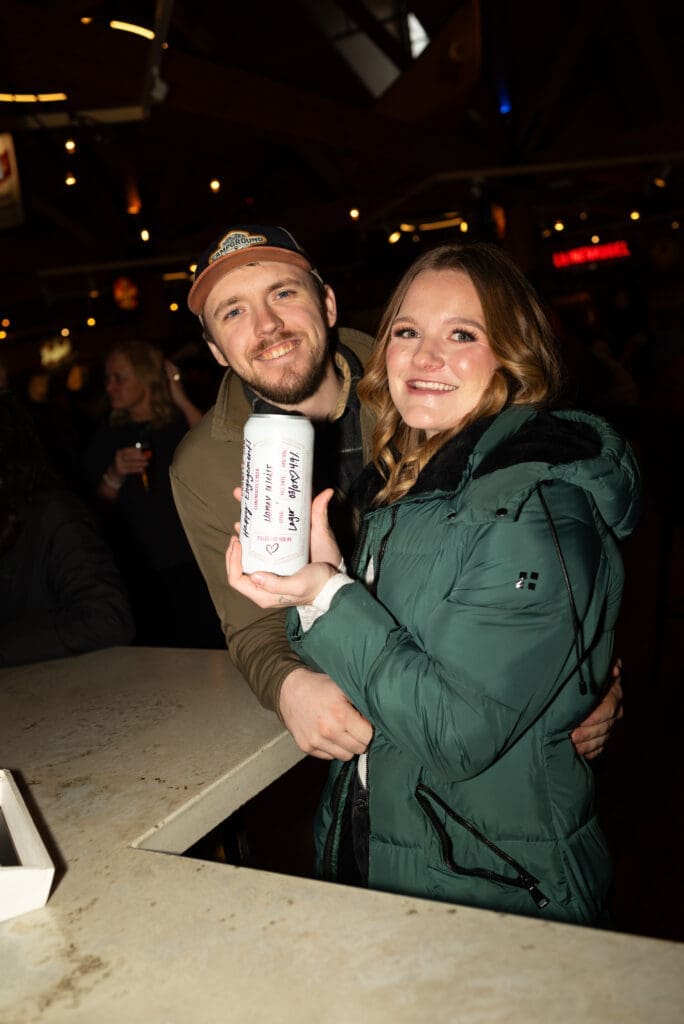 Free crowler free beer at the Leinie Lodge for celebrating their engagement there. Eau Claire wedding photographer