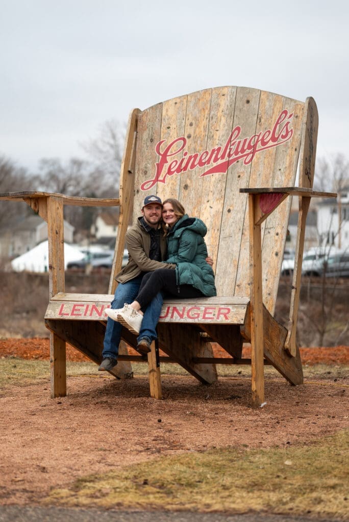 Engagement photos in the big chair at the Leinie Lodge in Chippewa Falls, WI. Eau Claire wedding photographer