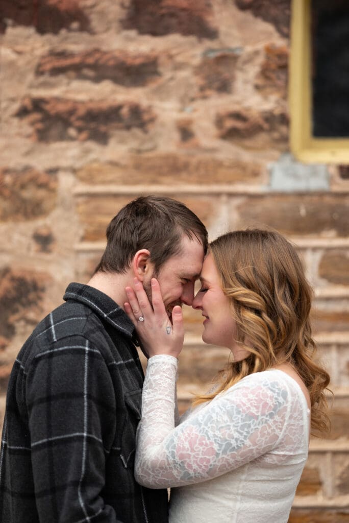 couple in embrace for their Leinienkugel's engagement session near Eau Claire, WI. Editorial wedding photographer near me