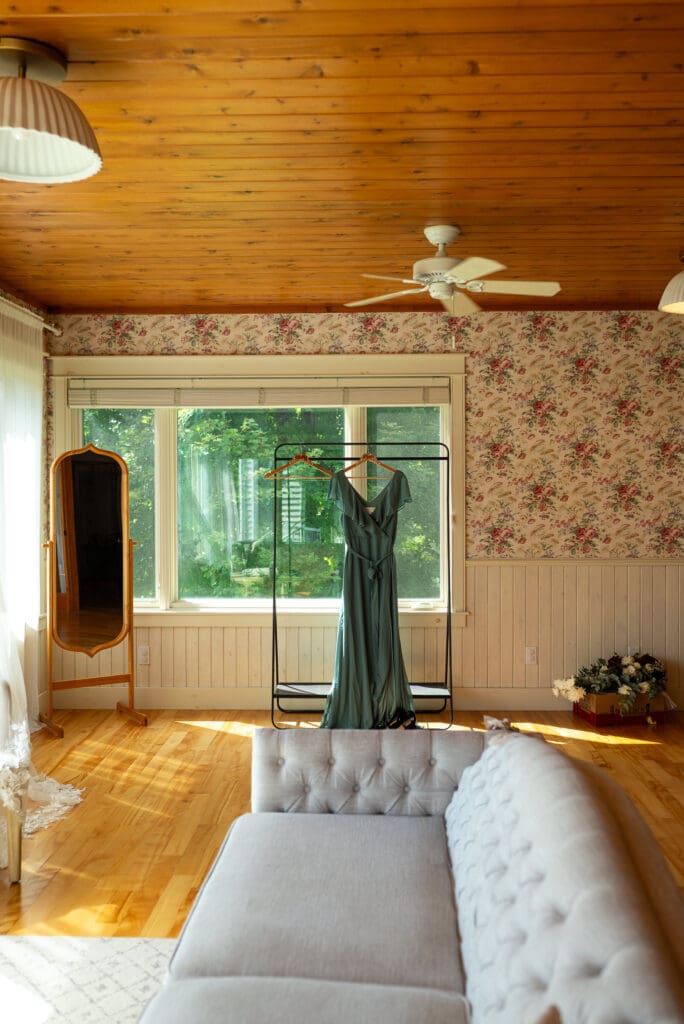 Dress hanging in getting ready area at Maidenwood wedding venue in La Crosse, WI