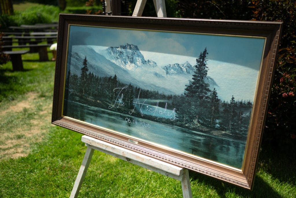 thrifted oil painting wedding signage. Pepin photographer