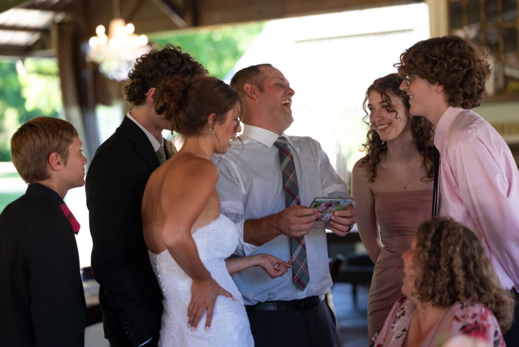 Cocktail hour shots with friends and family, like this one, are always already on you're wedding photographer's shot list