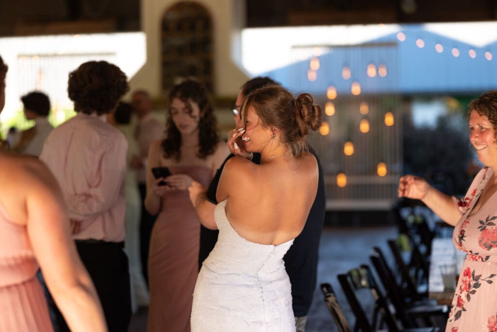 bride laughing on the dance floor. pepin, WI wedding photographer