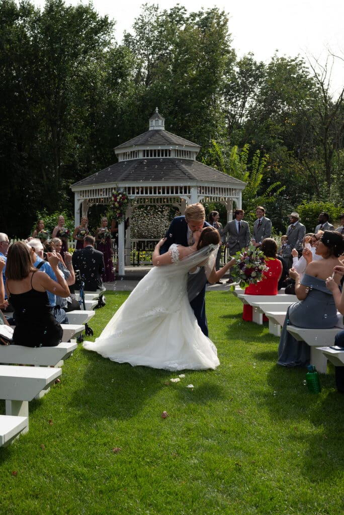 Dip and kiss down the aisle at Blooming Barrel, a Baldwin wedding venue