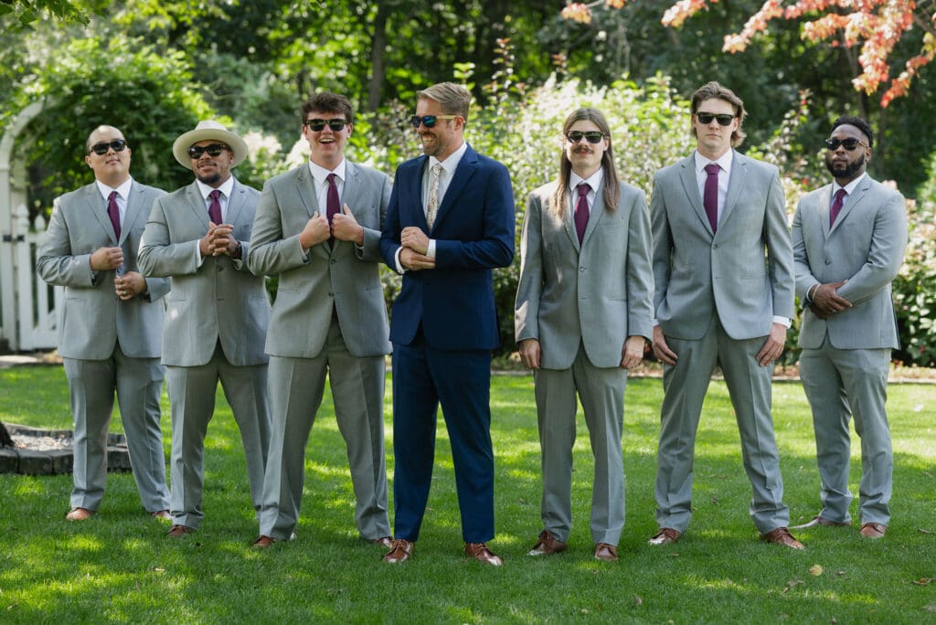 Groom and groomsmen at blooming barrel