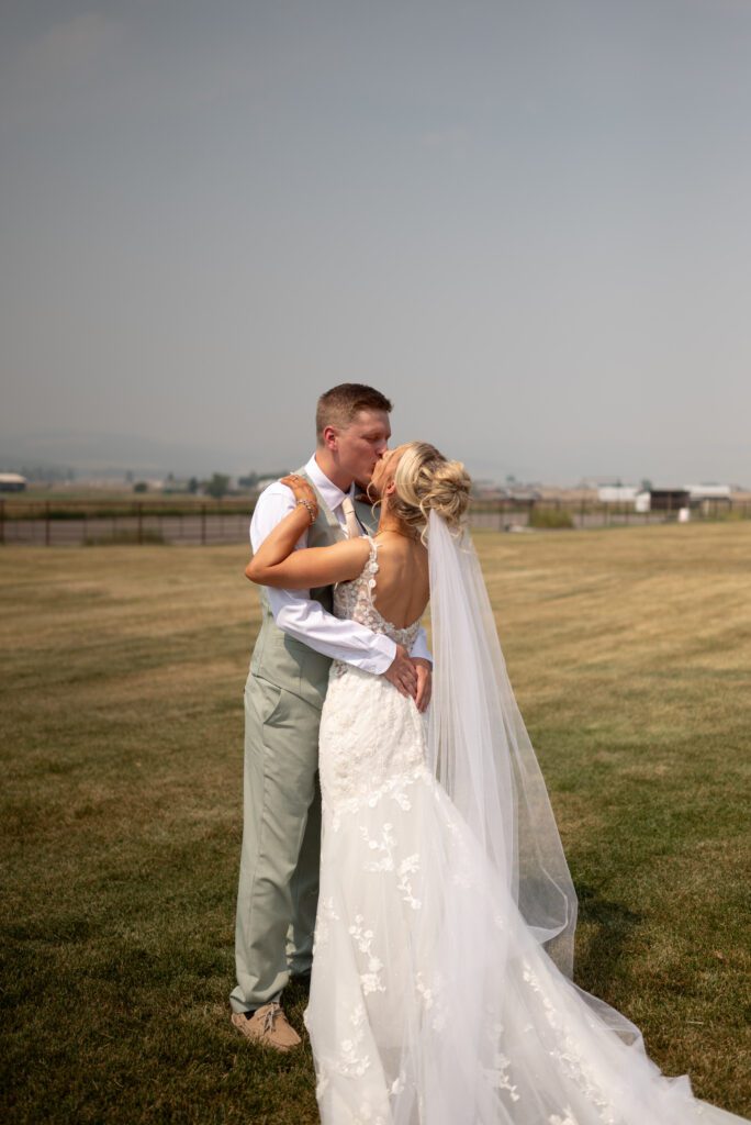 Bride and groom in embrace at their Montana mountain elopement