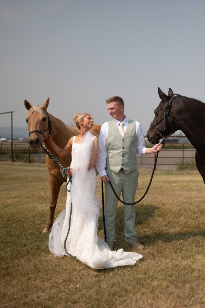Bride and groom posing with horses from 4P Horse Ranch AirBnB