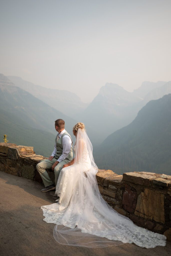 Bride and groom taking in the mountain view at glacier national park
