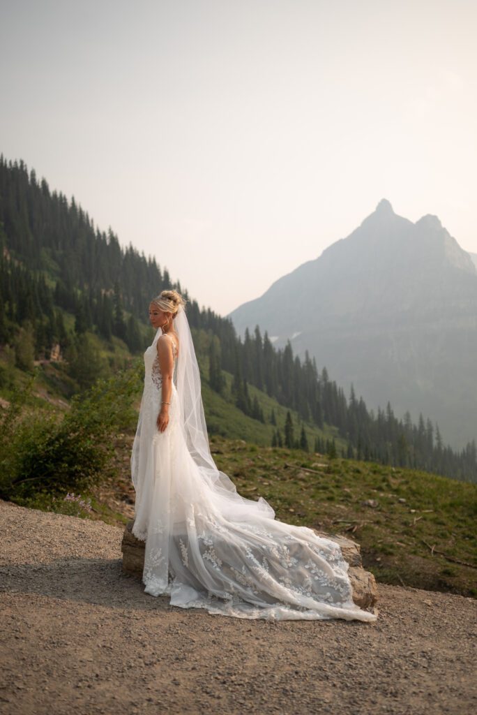 Stunning bridal portrait at glacier national park in montana taken by Maddie, a Wisconsin based wedding photographer