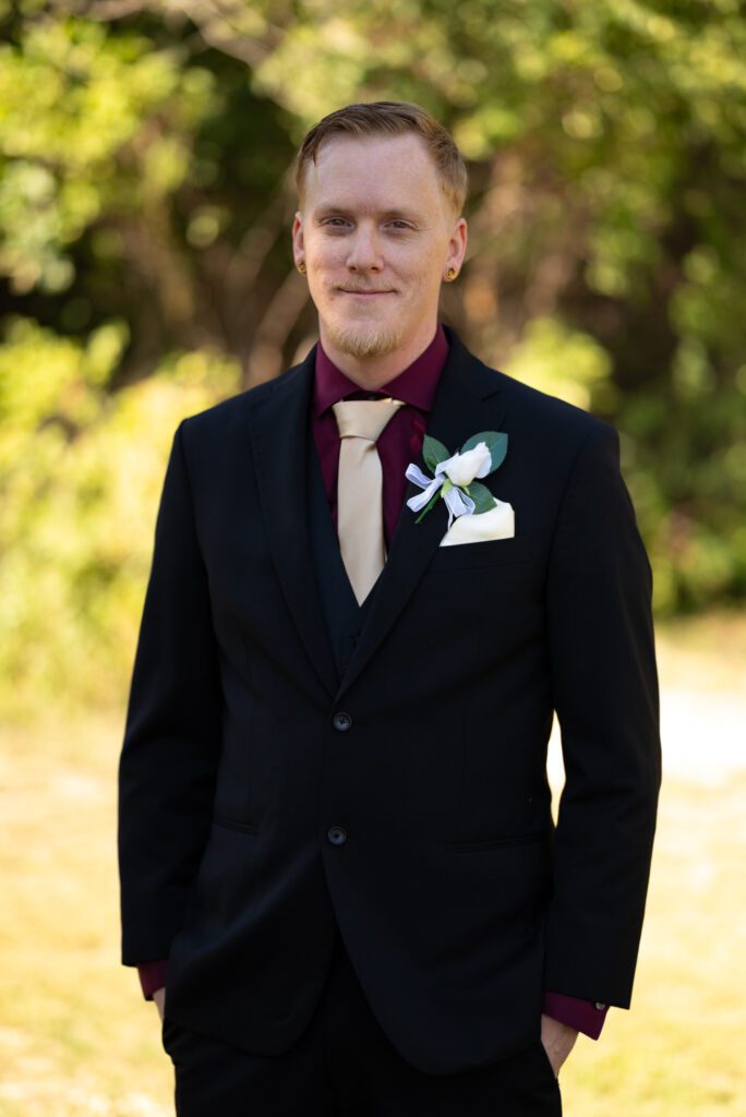 Groom before 1st look at The Bluffs Bar and Grill
