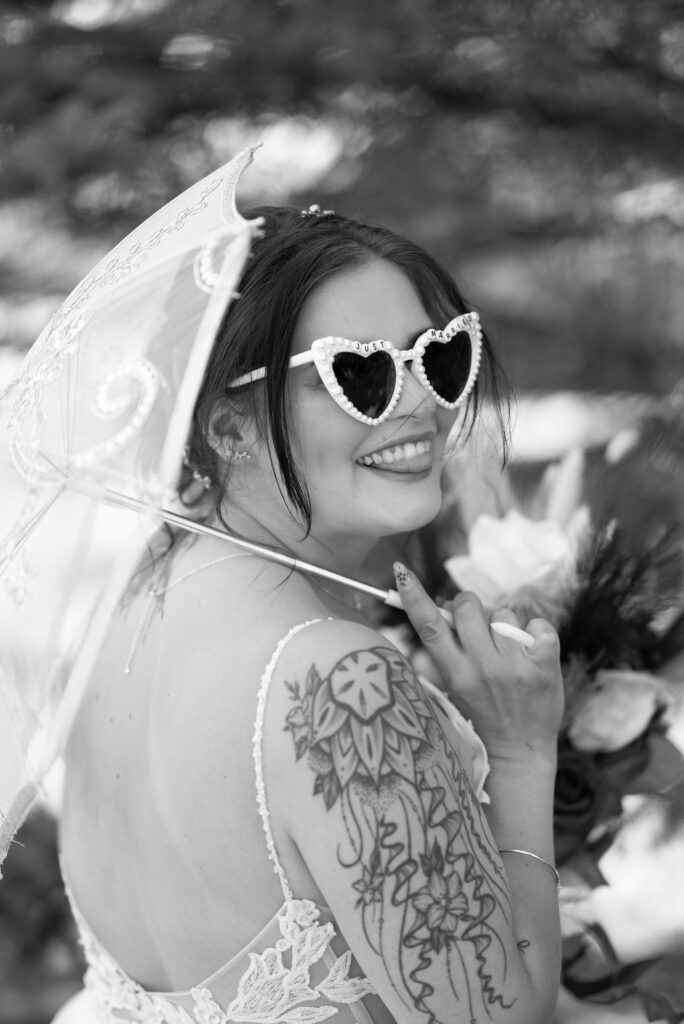 tattooed bride with vintage bridal sunglasses and white parasol