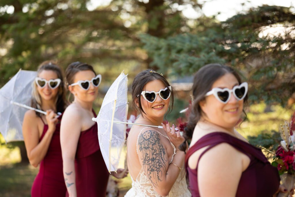 non-traditional tattooed bride in vintage style sunglasses and parasol