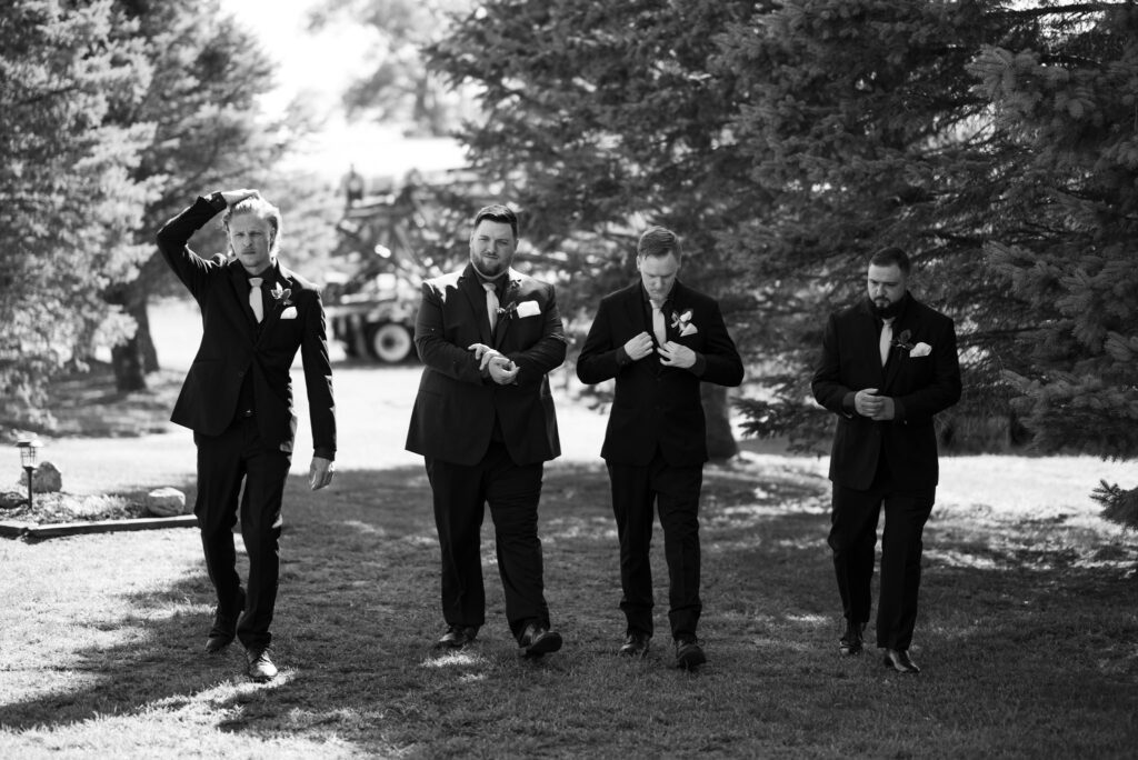 groom and guys walking
