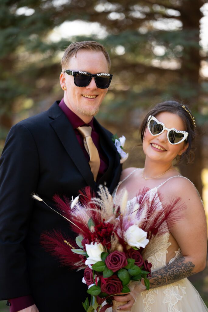 bride and groom smiling at camera