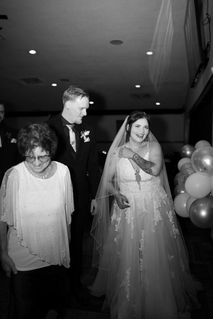 black and white flash photo of bride and groom at reception