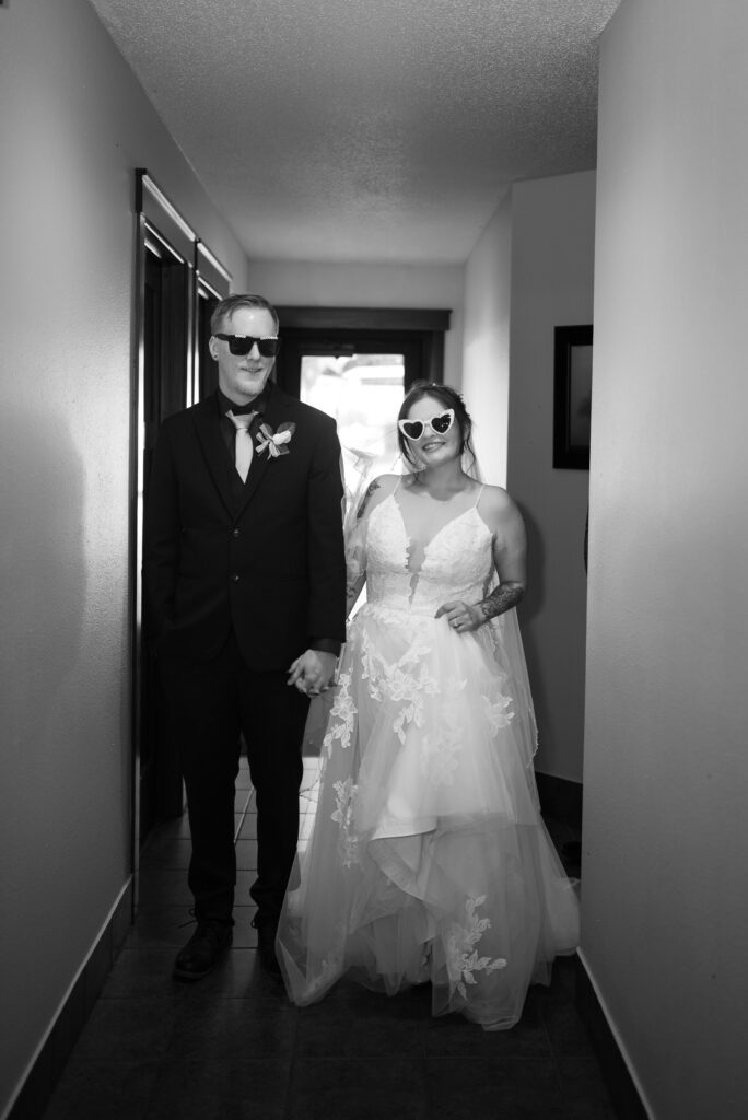 black and white flash image of bride and groom waiting for grand entrance