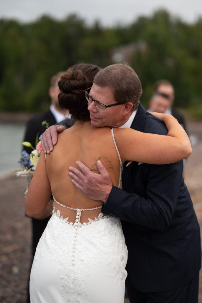 bride hugging dad