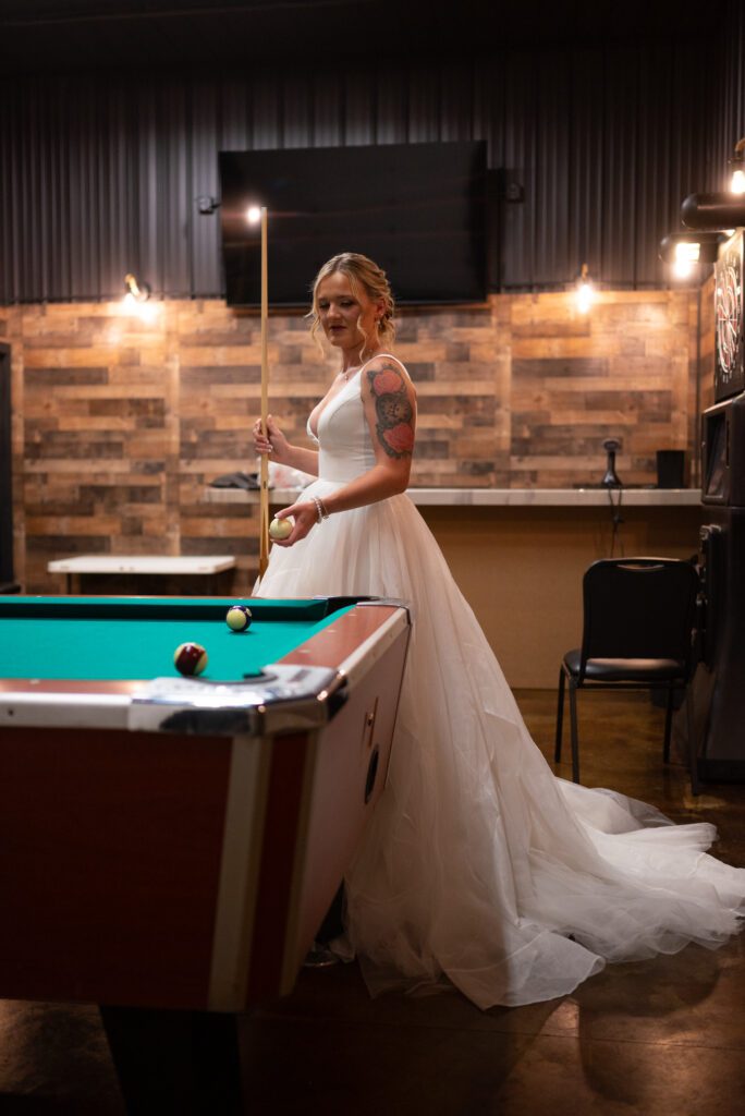 Bride playing pool before wedding