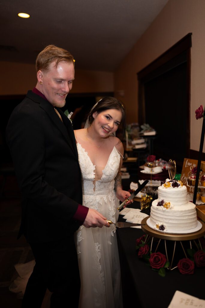 cutting the cake at wedding reception
