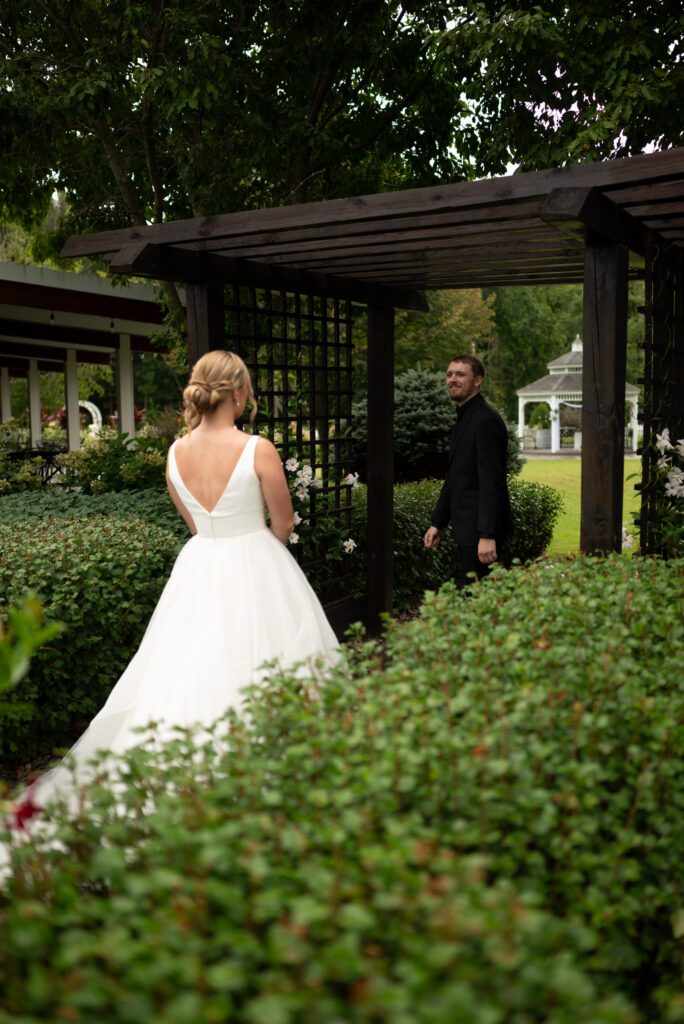 bride and groom first look at Blooming Barrel, a Baldwin wisconsin wedding venue