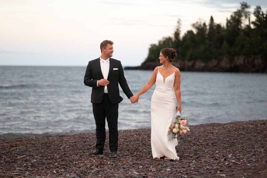 Bride and groom portrait along Lake Superior at their MN North Shore wedding