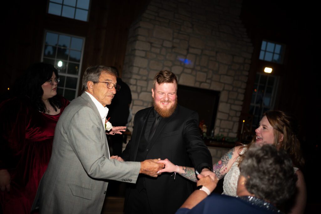 groom and family dancing