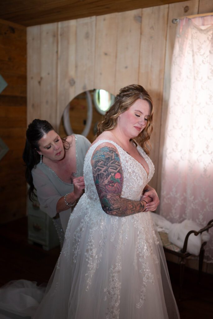 bride getting into dress