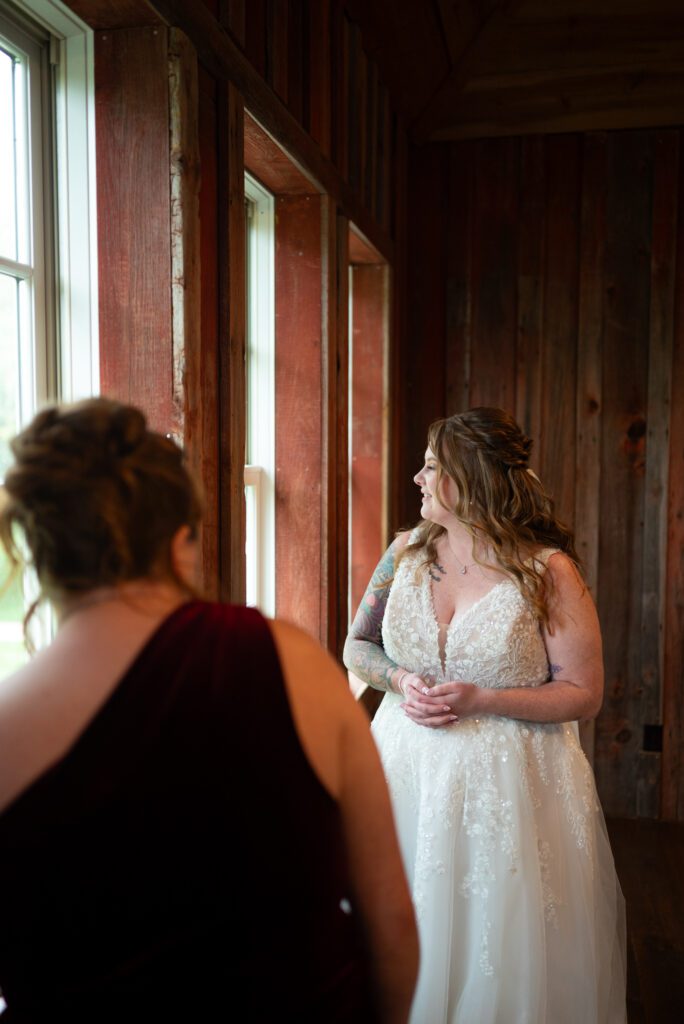 bride and sister looking out window