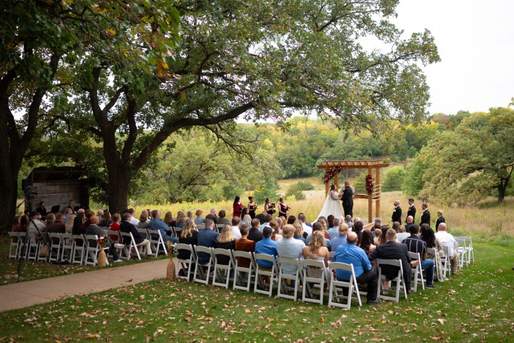 Almquist Farm MN wedding ceremony photographed by Maddie, a true to color editorial wedding photographer