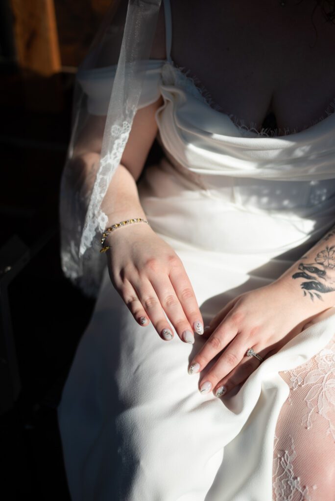 bee flying around bride's jewelry