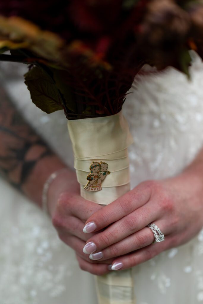 Bride's vintage pin on bridal flowers